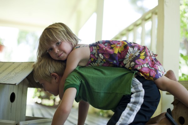 Brother and sister playing together. Photo. Tim Pannell