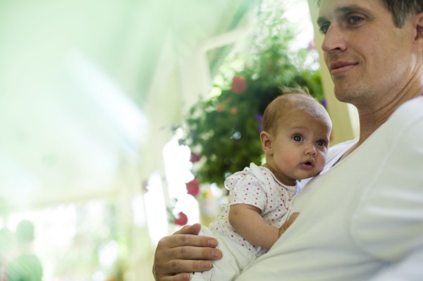 Father and baby daughter sitting on porch. Photo. Tim Pannell