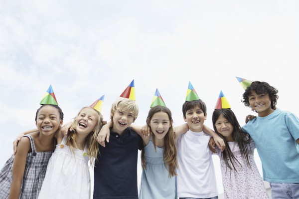 Group of children at a birthday celebration. Photo. momentimages