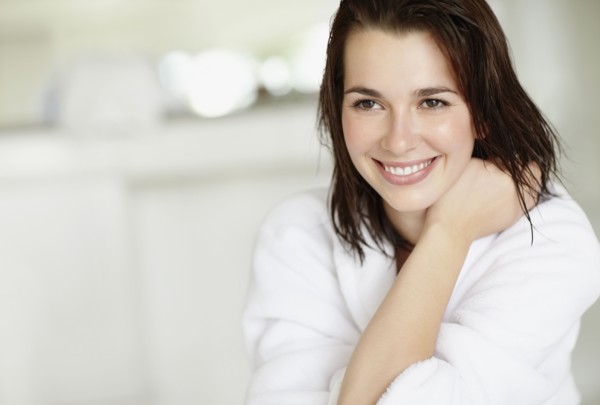 Woman wearing bathrobe. Photo. momentimages