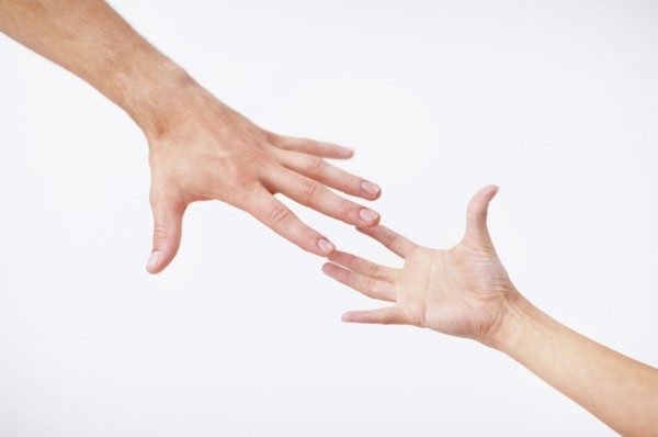 Hands reaching. Photo. momentimages