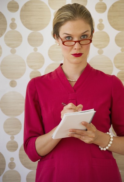 Kitsch looking secretary taking dictation.