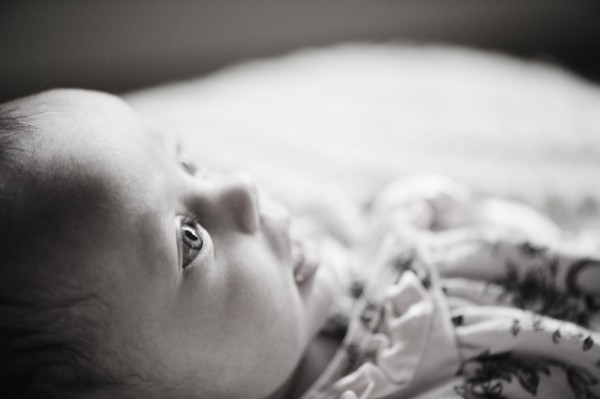 Baby lying down. Photo. Jamie Grill