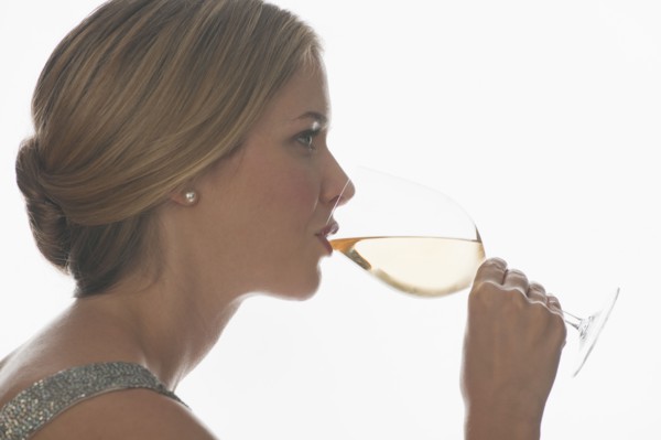 Sophisticated woman drinking wine.
