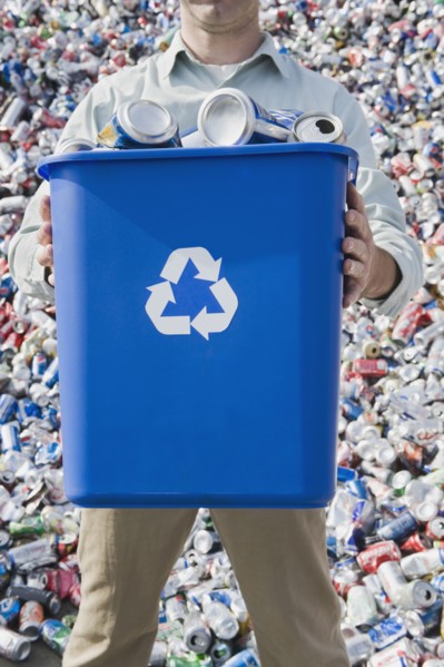 Man holding blue bin.