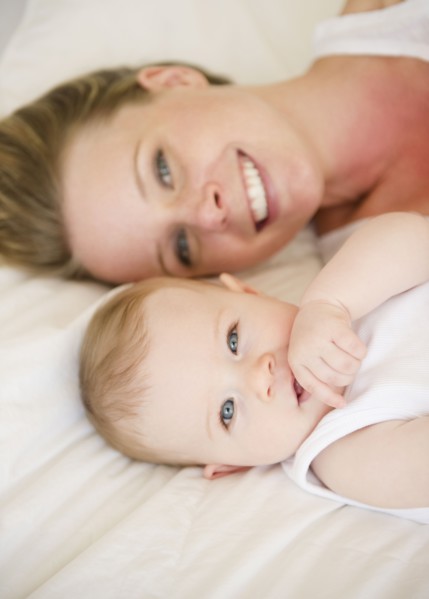 Mother and baby lying down together. Photo. Jamie Grill