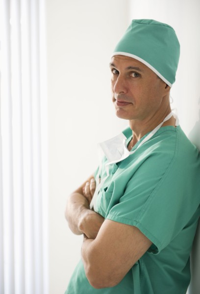 Surgeon wearing medical scrubs.