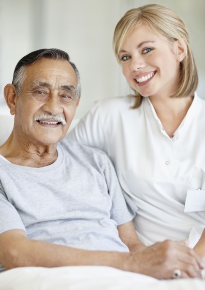 Nurse sitting with patient. Photo. momentimages