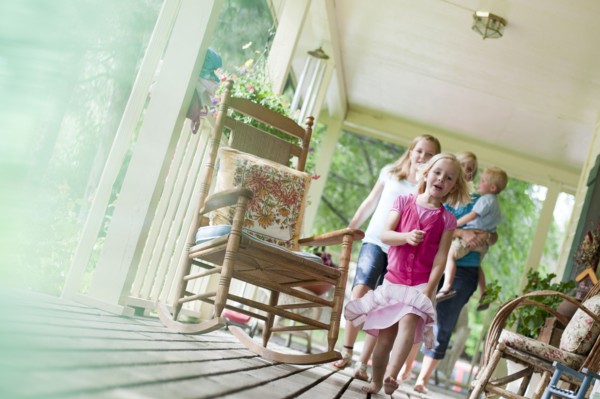 Family on porch. Photo : Tim Pannell