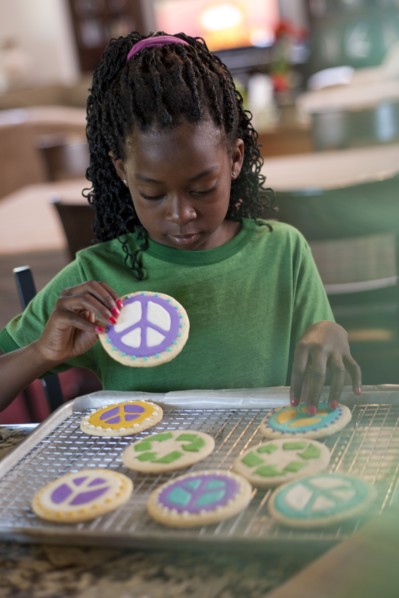 Young girl baking cookies. Photo. Tim Pannell