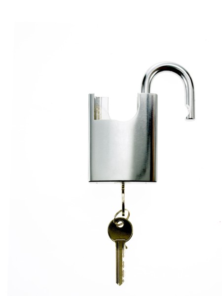 Key in padlock. Photo : David Arky