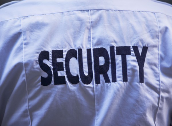 Back of security guard`s shirt. Photo : fotog
