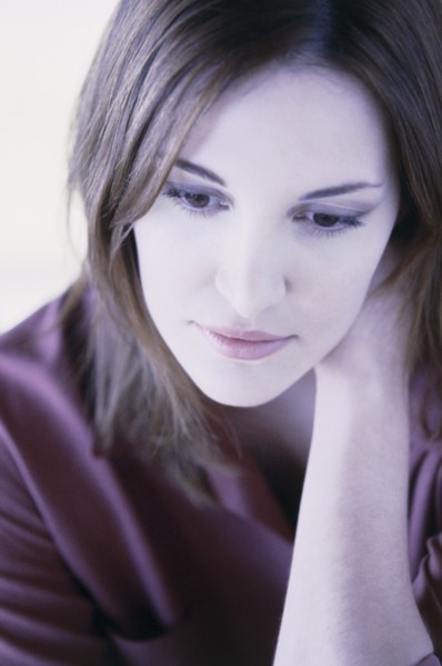 Pensive woman. Photo : Fisher Litwin
