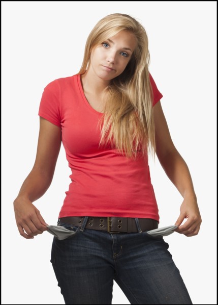 Young woman on white background showing empty pockets. Photo : Mike Kemp