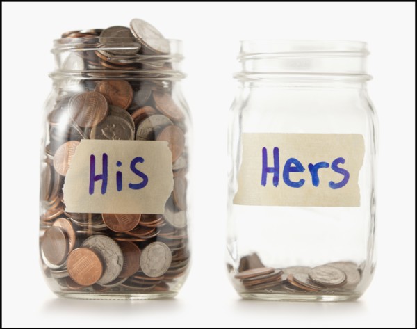 Studio shot of two jars with coins labeled "Hers" and "His". Photo : Mike Kemp