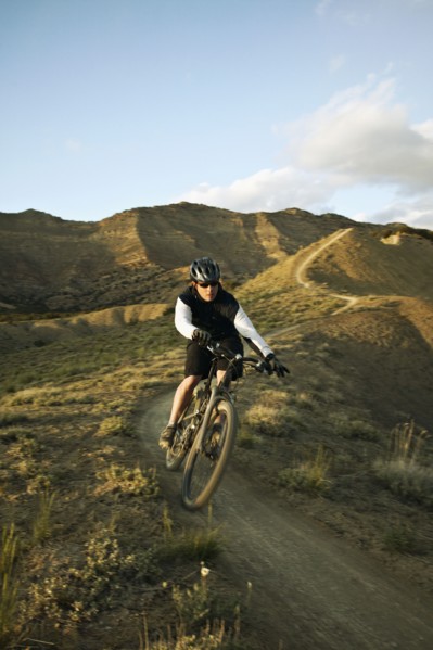 Man mountain biking on mountain track. Photo : Shawn O'Connor
