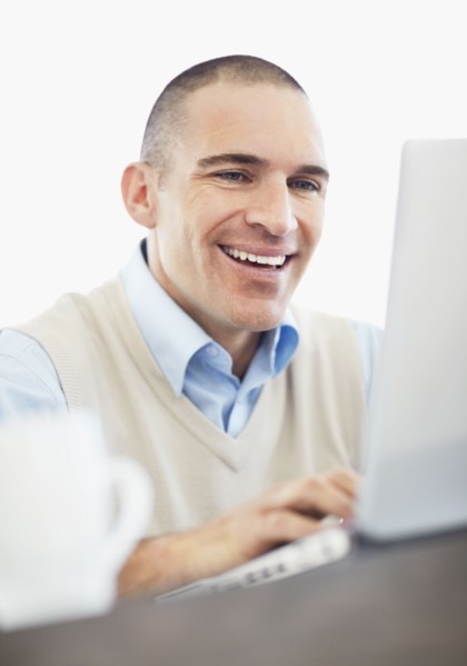 Portrait of cheerful office worker. Photo : Momentimages