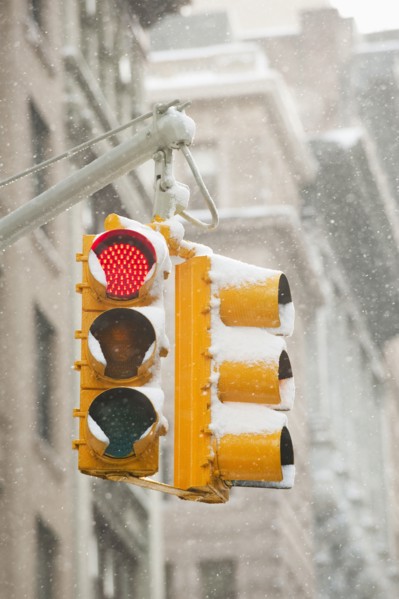 USA, New York, New York City, Snow covered traffic lights.