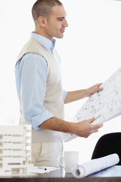 Architect working in office. Photo : Momentimages
