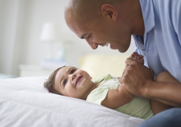 Father with small girl (12-18 months).