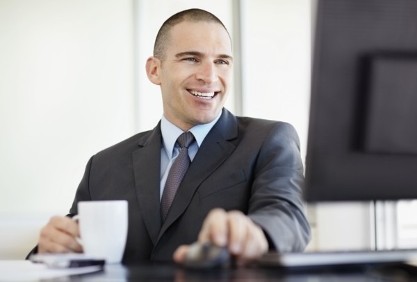 Businessman working in office. Photo : Momentimages