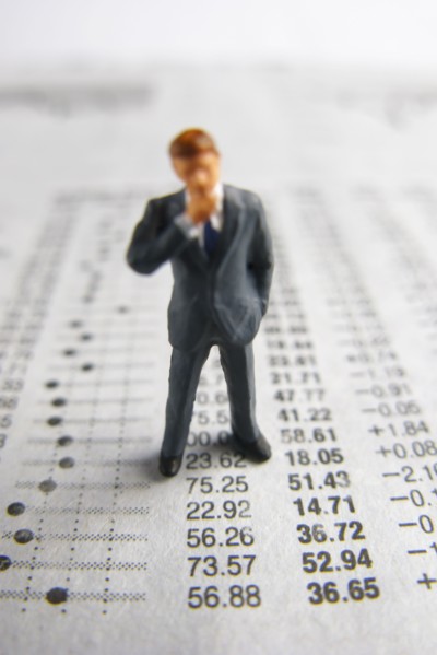 Model businessman on financial figures. Photo : Antonio M. Rosario