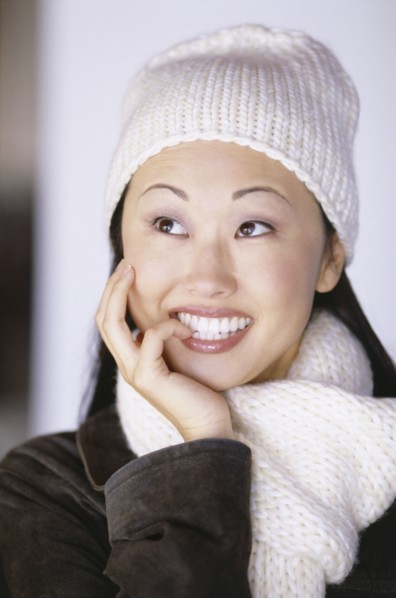 Pretty woman wearing winter hat and scarf. Photo : Fisher Litwin