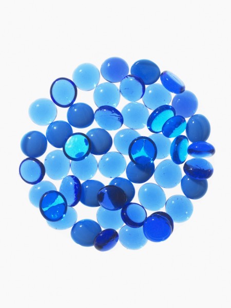 Studio shot of blue glass beads in sphere. Photo : David Arky