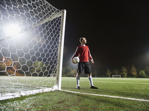 USA, California, Ladera Ranch, Football player preparing for penalty kick.