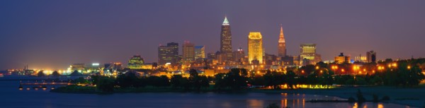 USA, Ohio, Cleveland, City skyline illuminated at dusk. Photo : Gary J Weathers