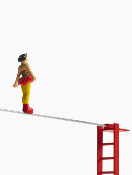 Studio shot of figurines on ladders. Photo : David Arky