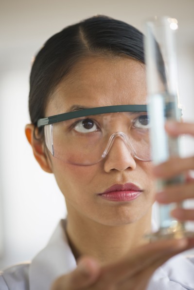 USA, New Jersey, Jersey City, Female scientist holding chemical test tube.