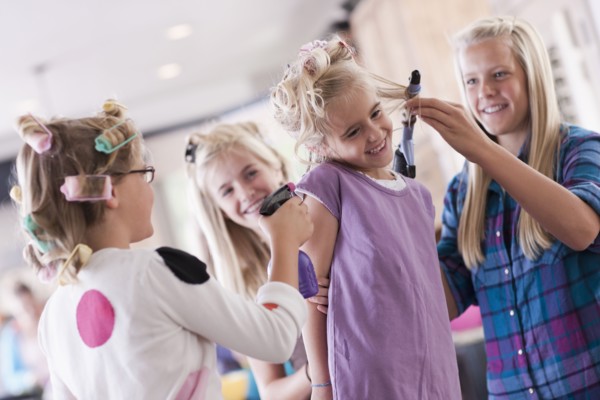 USA, Utah, family portrait of sisters (6-7, 8-9, 12-13, 14-15, 16-17) preparing hairs and having