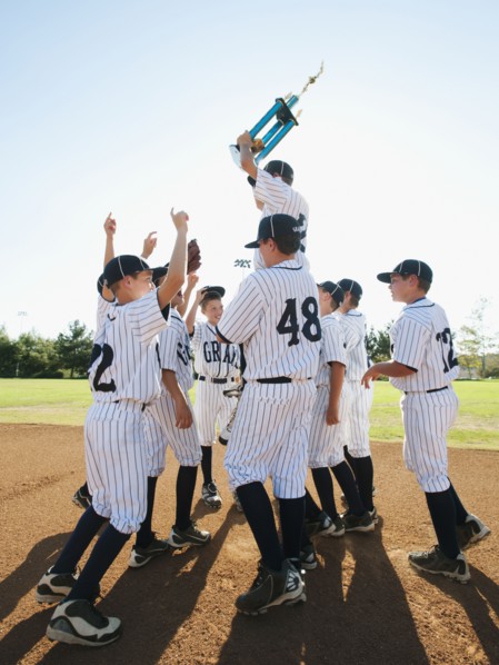 USA, California, Ladera Ranch, Boys (10-11) from Little league celebrating after winning.