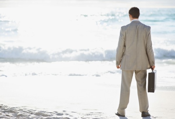 South Africa, Businessman standing, rear view. Photo : momentimages