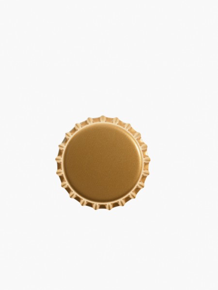 Studio shot of yellow bottle cap. Photo : David Arky