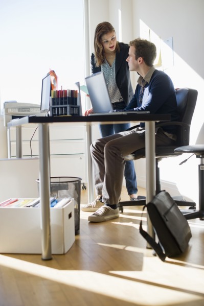 USA, New Jersey, Jersey City, Two young people in office.