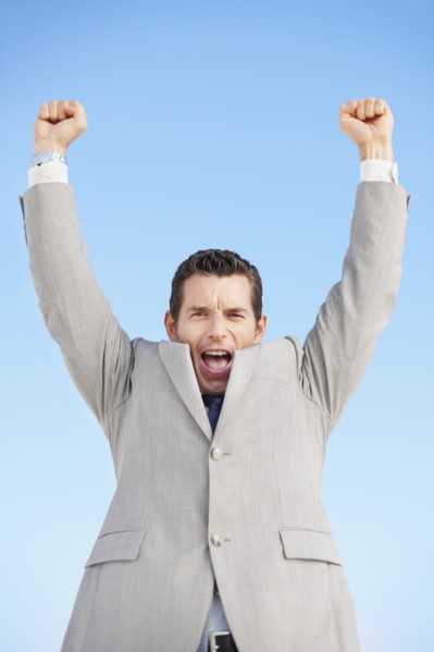 South Africa, Happy businessman, low angle view. Photo : momentimages