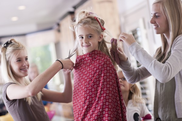 USA, Utah, family portrait of sisters (6-7, 8-9, 12-13, 14-15, 16-17) preparing hairs and having