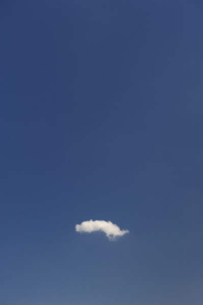 Single cloud in blue sky.
