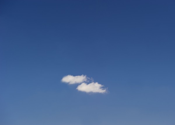 Single cloud in blue sky.