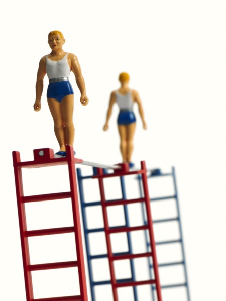 Studio shot of figurines on ladders. Photo : David Arky
