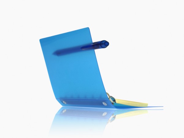 Studio shot of spiral notebook with pen. Photo : David Arky