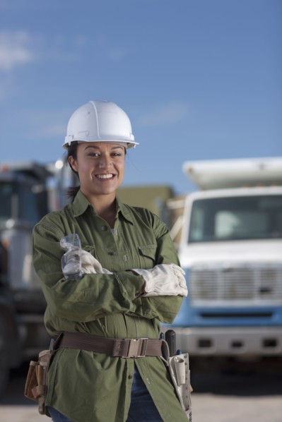 Portrait of female construction worker on building site. Photo : Dan Bannister