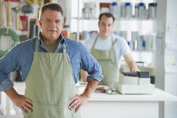 USA, New Jersey, Jersey City, Portrait of hardware shop owner and assistant.