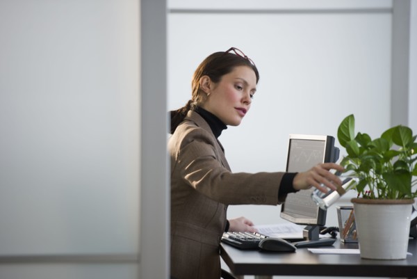 Portrait of young woman in office.