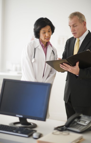 Female doctor s with hospital executive.
