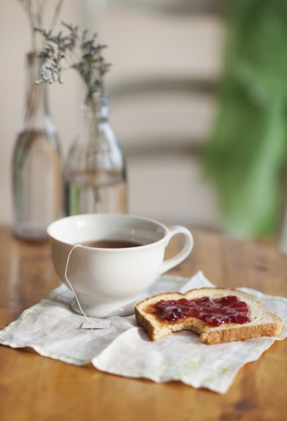 Cup of tea and toast with marmalade.