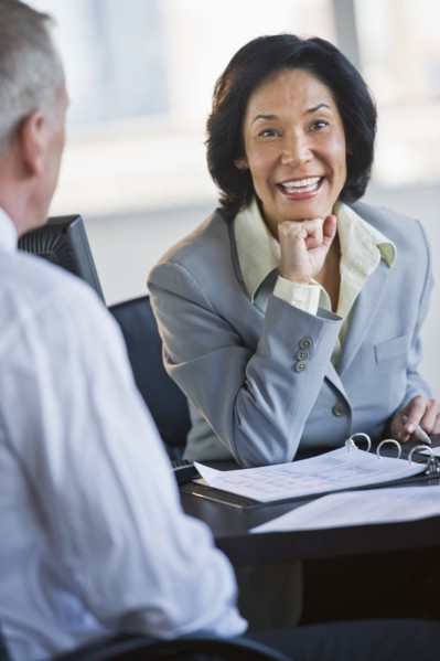 Businessman and businesswoman at meeting.