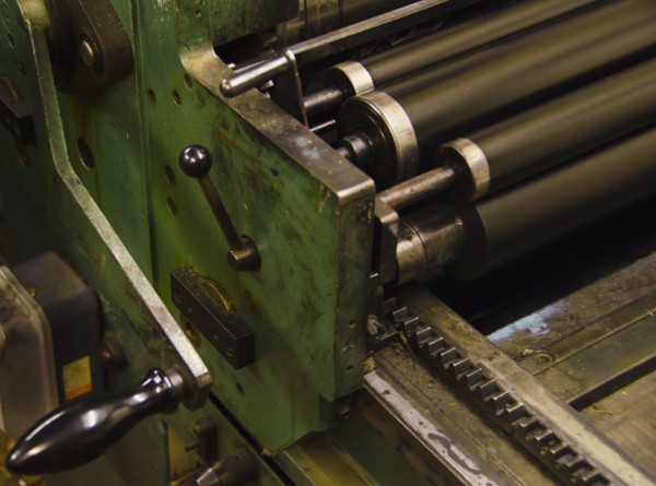 Close up of antique printing roller.